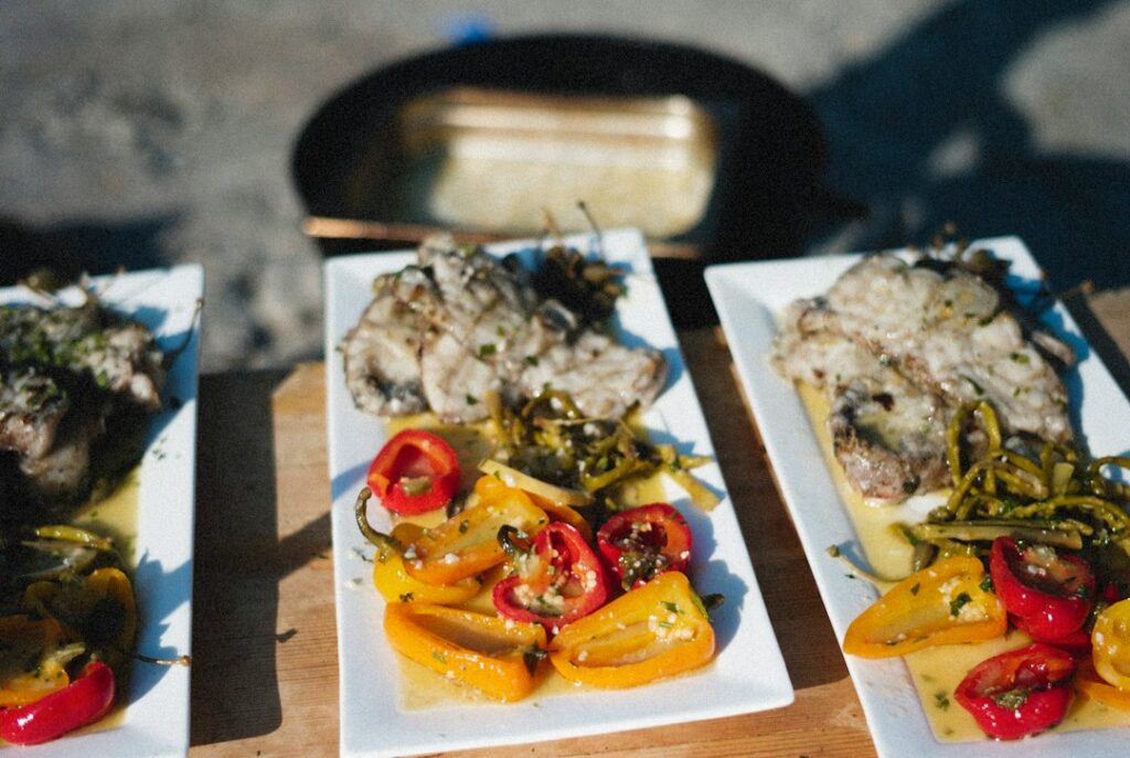 Piatto di pesce cucinato, fotografia illustrativa per la ricetta del baccalà alla napoletana